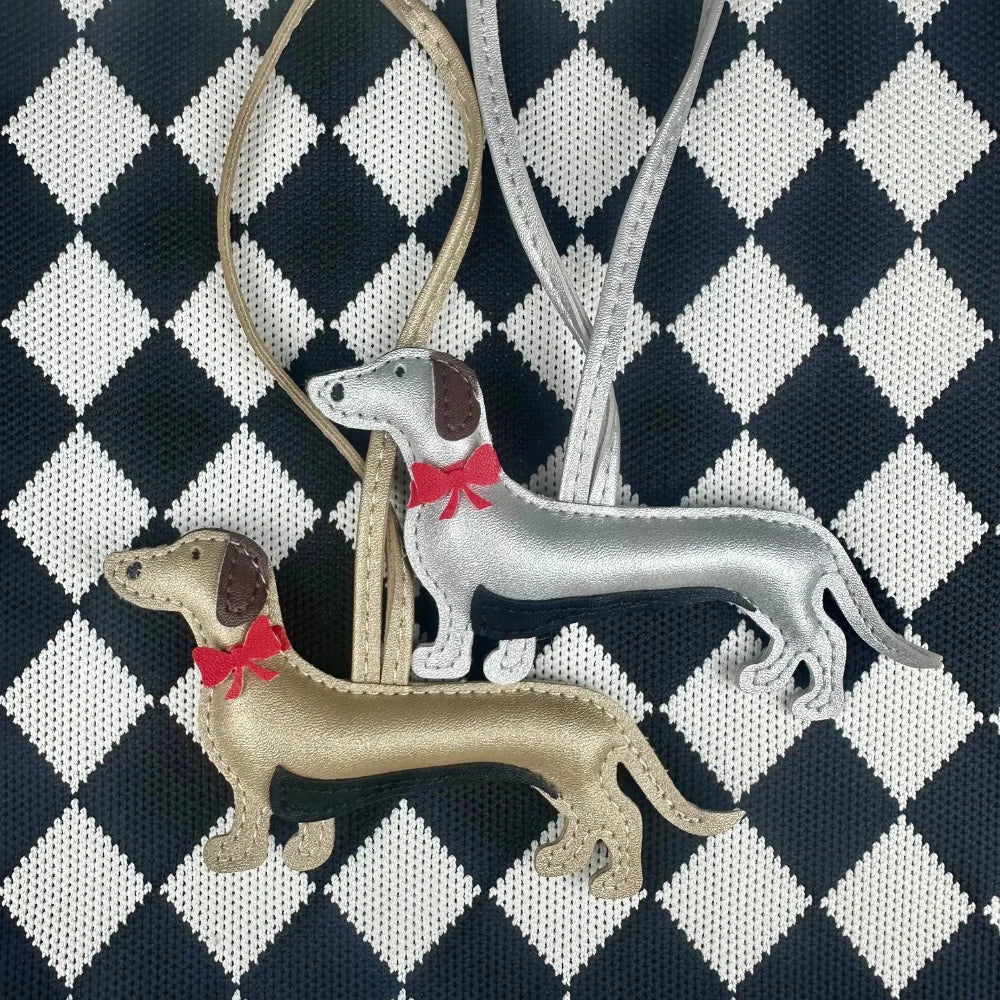 Elegant Dachshund Leather Bag Charm with Red Bow – Cute Pet Lover Gift